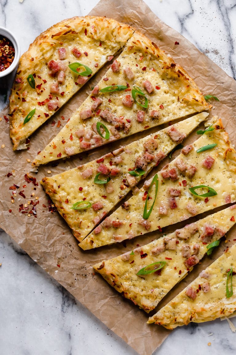 A savory egg and cheese breakfast pizza sliced into 6 pieces.