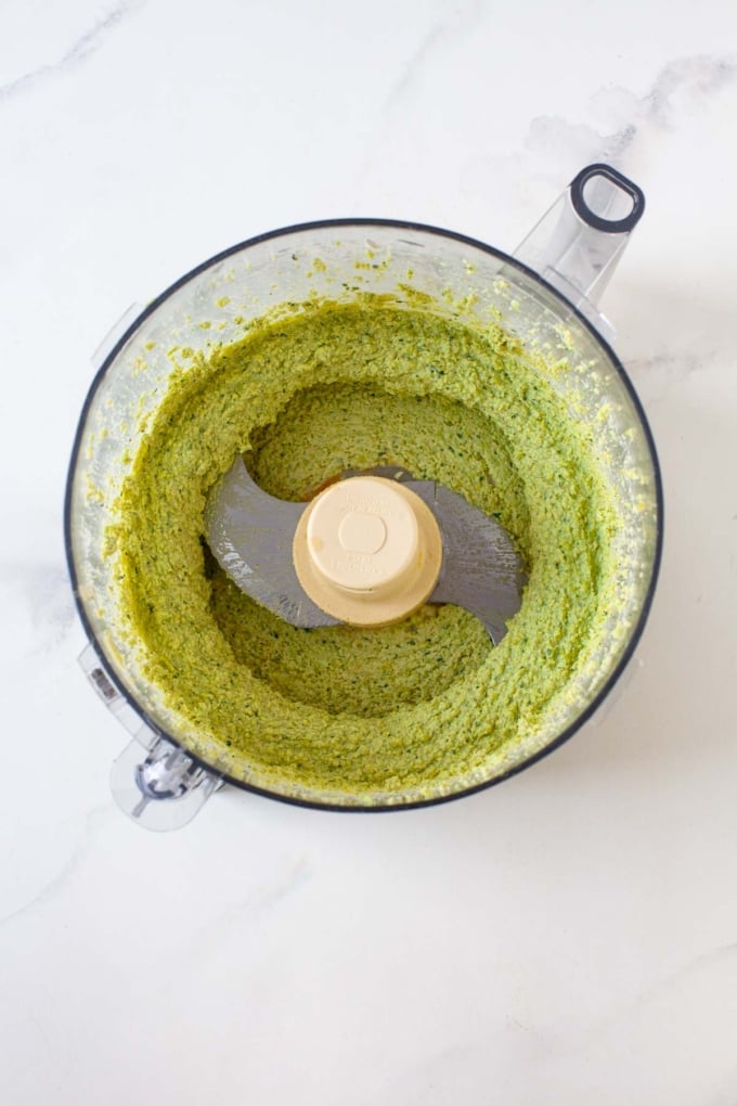 edamame spread in food processor on marble surface